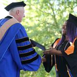 Western Nevada College Photo #3 - Western Nevada College President Chet Burton congratulates Cassandra Luster at the college's 2017 Commencement Ceremony on May 22 in Carson City. Luster was one of 551 graduates.