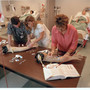 Maine College of Health Professions Photo #1 - two students learning how to do IV's